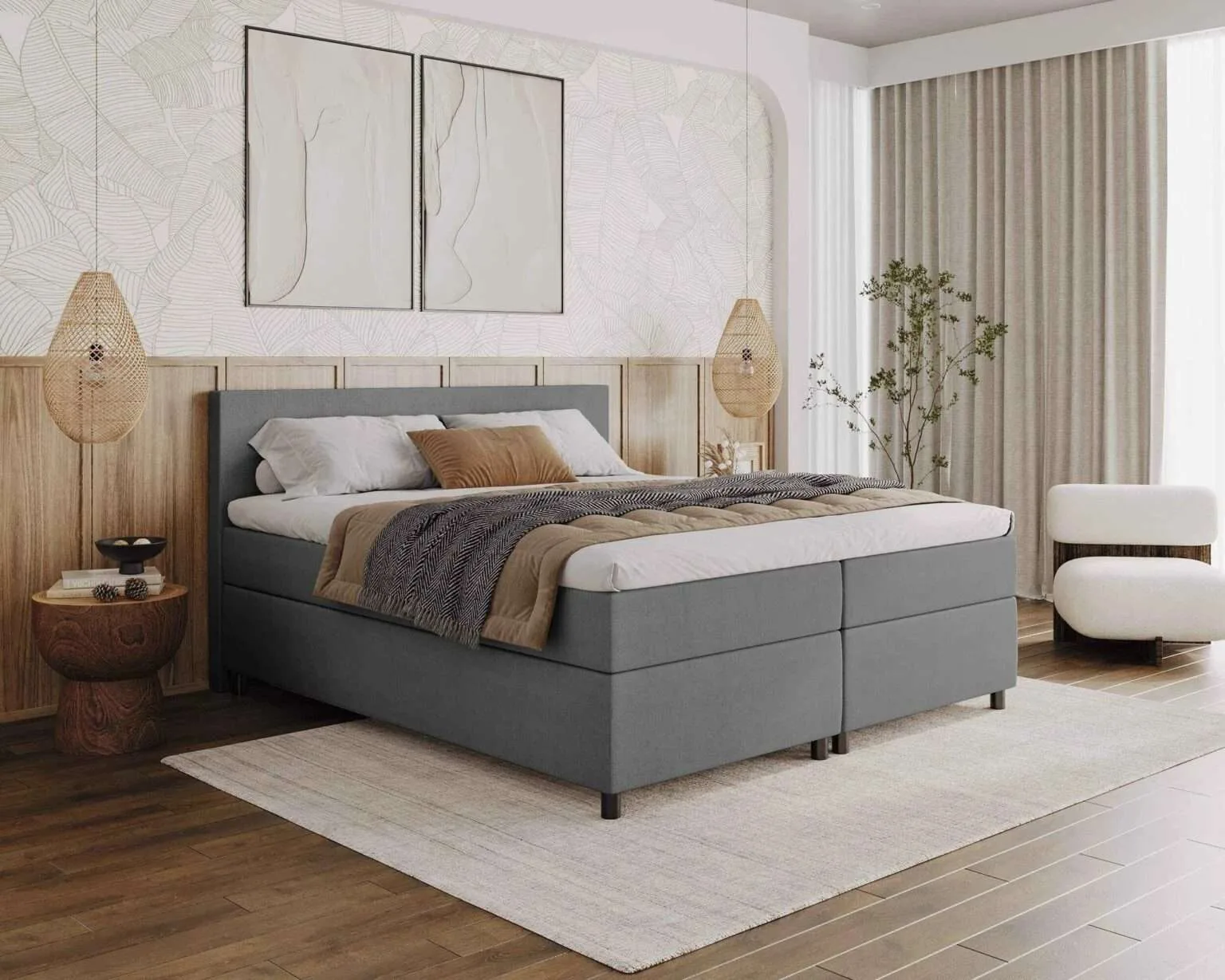 Boxspring Hoorn in grijze stof in een lichte slaapkamer